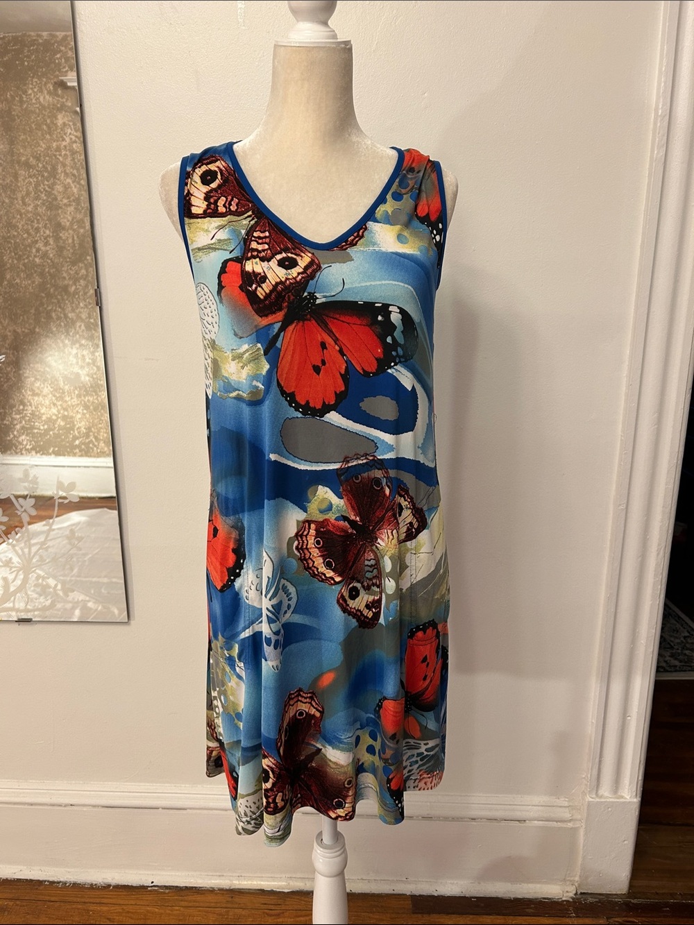 Vintage Sleeveless Blue Dress with Bold Red Butterfly Print